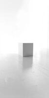 A white box is sitting on a white floor photo
