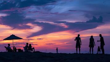 Beach holiday captured in striking silhouette against the vibrant evening sky photo