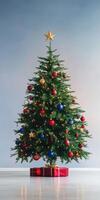 Beautifully Decorated Christmas Tree with Red and Gold Ornaments and Star Topper photo