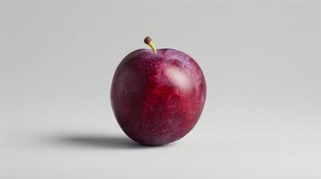 Minimalist concept with a single plum on a white background photo