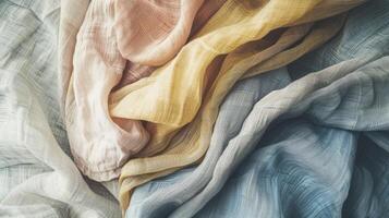 A pile of colorful fabric with a variety of shades of blue photo