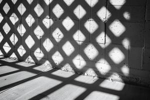 Geometric Shadow Patterns on a Sunlit Wall Creating a Striking Visual Effect photo