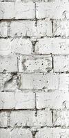 Textured White Brick Wall Background with Cracks and Weathered Surface photo