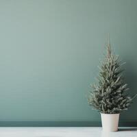 Minimalist Green Christmas Tree in White Pot Against a Soft Green Wall in a Modern Interior Setting photo