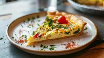 Clean and modern presentation of a slice of quiche on a plate photo