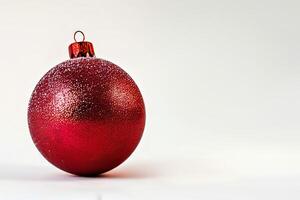 A red ornament with a red ball on top photo