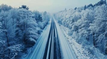 Drone shot of a road trip through a snowy wonderland photo