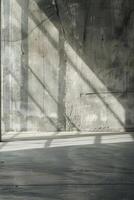 Sunlight Casting Shadows on Industrial Concrete Wall in Minimalist Architectural Space photo