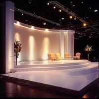 Elegant Modern Stage Setup with Curved White Backdrop photo
