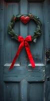 Heart-shaped wreath and red ribbon on a door for Valentine's Day welcome. photo