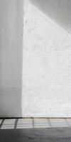Sunlight Casting Shadows on Minimalist White Brick Wall in Modern Interior Space photo