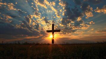 Backlit silhouette of a cross-shaped arrangement of clouds photo