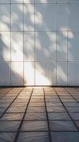 Sunlight and Shadows on Modern Tiled Wall and Floor Creating a Minimalist Urban Aesthetic photo