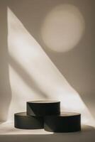 Minimalist Abstract Composition with Three Black Cylindrical Shapes photo