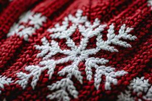 Close-Up of Red and White Knitted Fabric with Intricate Snowflake Patter photo