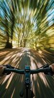 Dynamic POV of Speeding Bicycle Through Lush Forest Path Capturing Motion Blur and Vibrant Greenery photo