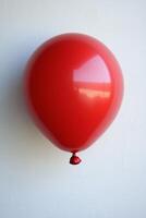 A red balloon with a red string attached to it photo