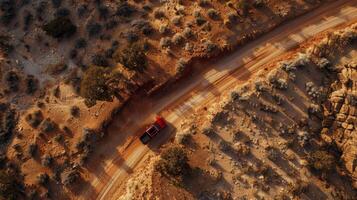 Aerial view of a road trip adventure through rugged wilderness terrain photo