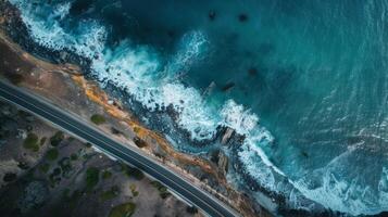 Bird's eye view of a road trip expedition along a coastal road with ocean views photo