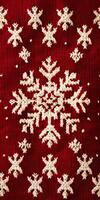 A red and white knitted snowflake pattern photo