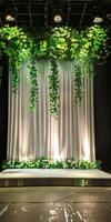 Elegant Stage with Greenery and Drapes photo