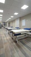Wide angle view of a physiotherapy room with room for logos. photo