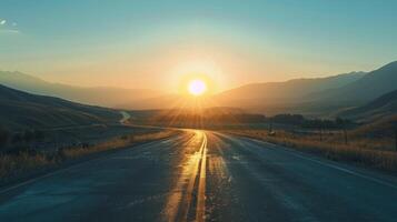 Mountain pass silhouette framed by the setting sun on a road trip photo