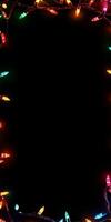 Vibrant Festive String Lights on Black Background Creating a Colorful Holiday Border with Copy Space photo