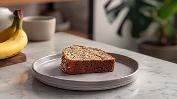 Clean and modern presentation of a slice of banana bread on a plate photo