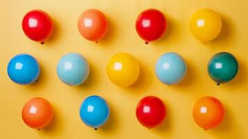 Colorful balloons arranged neatly in a top-down composition photo