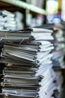 Stacks of Documents in Office Environment Highlighting Organizational Challenges photo