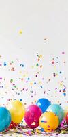 A bunch of colorful balloons are scattered on a white background photo