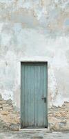 Weathered Wooden Door on Rustic Stone Wall with Peeling Paint in Vintage Architectural Setting photo