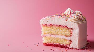 Delicious Slice of Vanilla Cake with Pink Frosting and Colorful Sprinkles photo