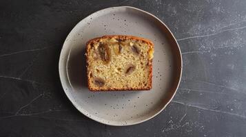 Clean and modern presentation of a slice of banana bread on a plate photo