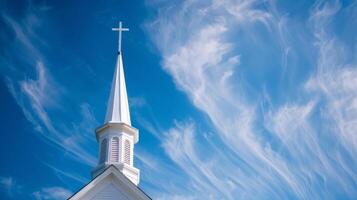 Copy space featuring a church steeple against a clear blue sky, symbolizing hope photo
