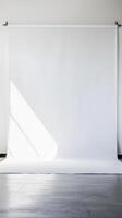 Minimalist Photography Studio with White Backdrop and Natural Light photo