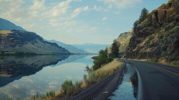 A road with a river running alongside it photo
