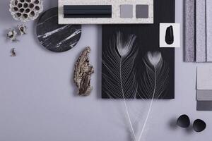 Creative flat lay composition in grey and black color palette with textile and paint samples, panels and tiles. Architect and interior designer moodboard. Top view. Copy space. Template. photo