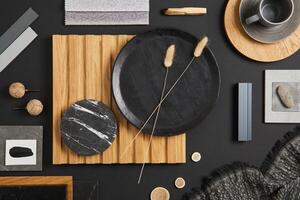 Stylish flat lay comosition of creative architect moodboard with black, beige and grey samples of textile, paint, wooden lamella panels and marble tiles. Top view. Copy space. Template. photo