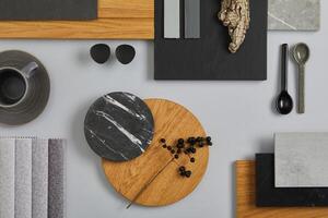 Elegant architect moodboard flat lay composition in light grey, black and brown color palette with textile and paint samples, wooden panels and marble tile. Top view. Copy space. Template. photo