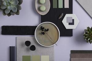 Stylish architect and interior designer moodboard. Flat lay composition in grey and green color palette with textile and paint samples, panels and tiles. Top view. Copy space. Template. photo
