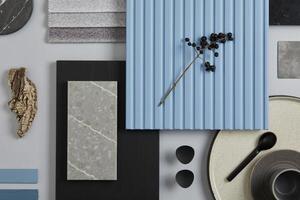Flat lay composition of stylish architect moodboard with samples of textile, paint, blue wooden lamella panels and tiles. White, black, blue and light grey color palette. Copy space. Template. photo