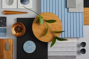 Flat lay of creative architect moodboard composition with samples of wood, textile, paint, lamella panels and tiles. Natural materials. Black, blue and light grey color palette. Copy space. Template. photo