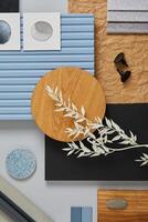 Flat lay of creative architect moodboard composition with samples of wood, textile, paint, lamella panels and tiles. Natural materials. Black, blue and light grey color palette. Copy space. Template. photo