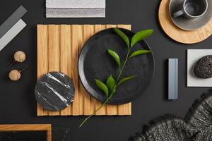 Stylish flat lay comosition of creative architect moodboard with black, beige and grey samples of textile, paint, wooden lamella panels and marble tiles. Top view. Copy space. Template. photo