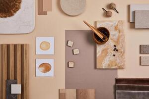 Flat lay of stylish architect moodboard composition with beige samples of textile, paint, wooden lamella panels and tiles. Top view. Copy space. Template. photo