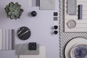 Elegant flat lay composition in grey and black color palette with textile and paint samples, lamella panels and tiles. Architect and interior designer moodboard. Top view. Copy space. photo