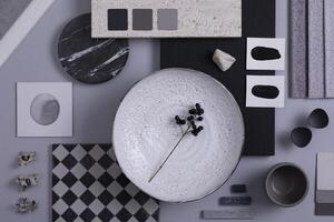 Creative flat lay composition in grey and black color palette with textile and paint samples, panels and tiles. Architect and interior designer moodboard. Top view. Copy space. Template. photo