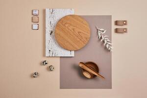 Creative flat lay composition with textile and paint samples, panels and cement tiles. Stylish interior designer moodboard. Light beige color palette. Copy space. Template. photo